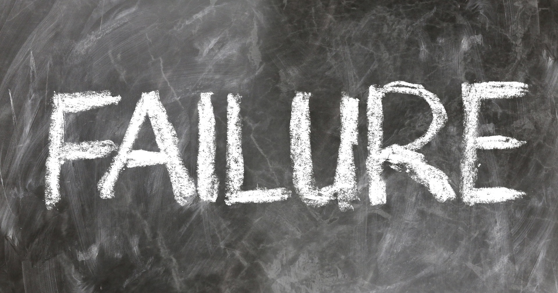 The word 'failure' chalked onto a blackboard.